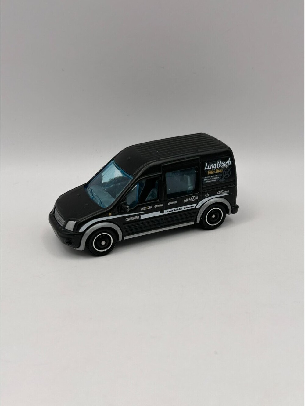 Matchbox 2010 Ford Transit Connect Black Long Beach Bike Shop Van MB798 1:64